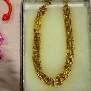 Golden Geometric Necklace with Intricate Design and Matte Finish